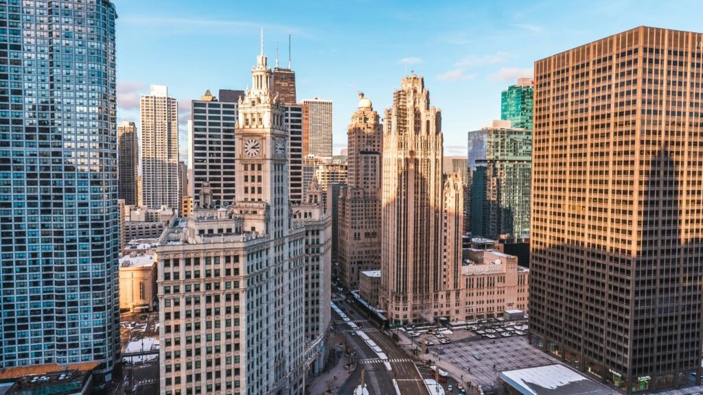 View of Chicago's iconic downtown skyline with historic skyscrapers under a clear blue sky.